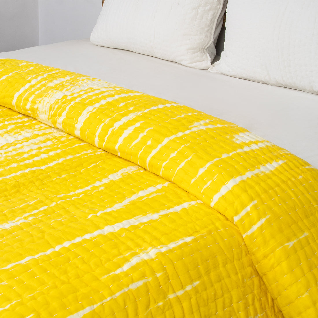 Handmade yellow tie-dye cotton Kantha quilt. Unique, vibrant &amp; cozy. Perfect as a blanket, throw, or wall hanging. Shop now!