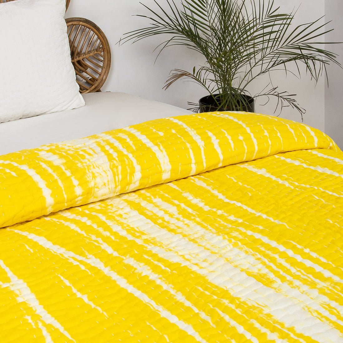 Handmade yellow tie-dye cotton Kantha quilt. Unique, vibrant &amp; cozy. Perfect as a blanket, throw, or wall hanging. Shop now!