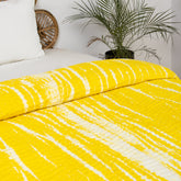 Handmade yellow tie-dye cotton Kantha quilt. Unique, vibrant & cozy. Perfect as a blanket, throw, or wall hanging. Shop now!