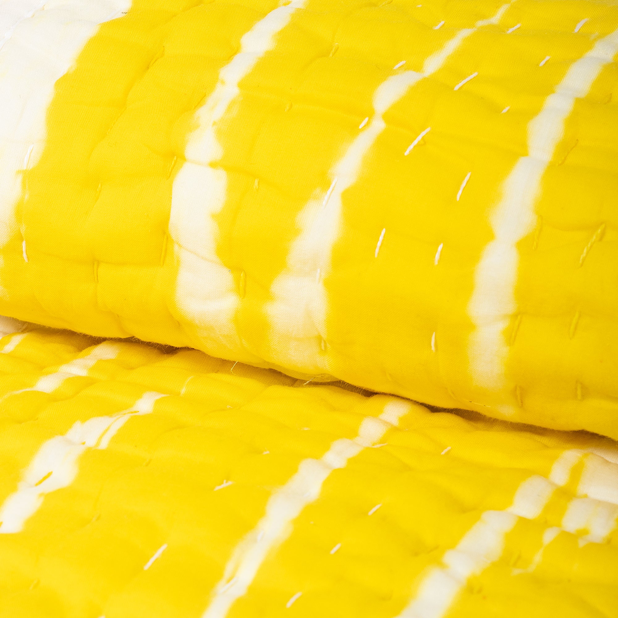 Handmade yellow tie-dye cotton Kantha quilt. Unique, vibrant &amp; cozy. Perfect as a blanket, throw, or wall hanging. Shop now!